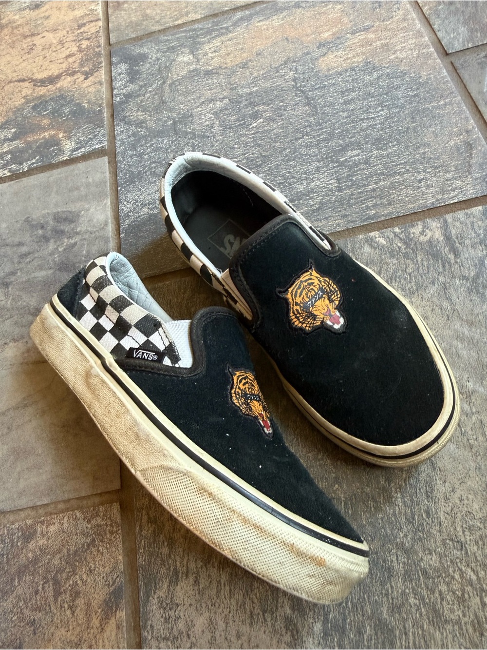 Vans Kids Black Slip-On Sneakers with Checkerboard Heel and Tiger Patch